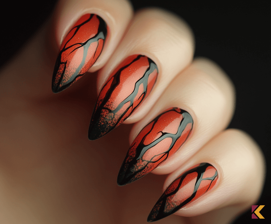 Długie paznokcie z bazą cynobrową i czarnymi zdobieniami