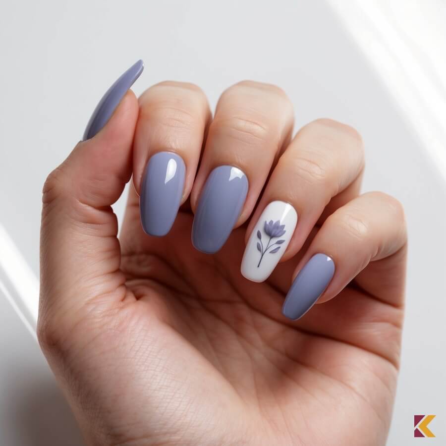 Paznokcie pastelowe, tropikalny indygo z kwiatem na jednym paznokciu